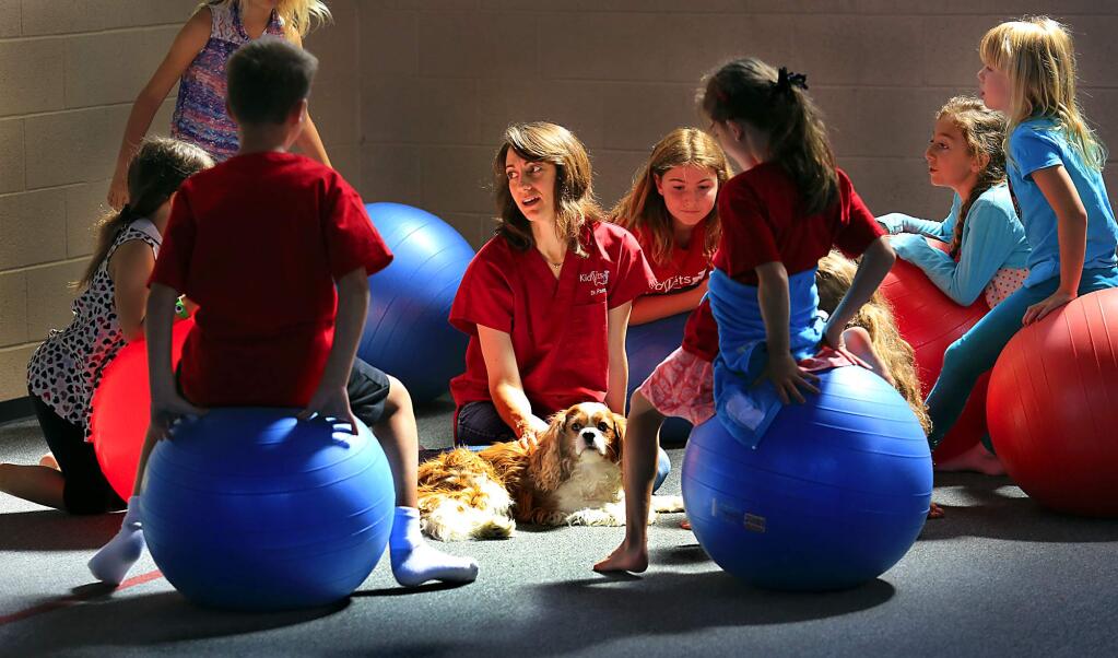 PHOTO: 1 by JOHN BURGESS / The Press Democrat -Veterinarian Pam Wittenberg uses her three-legged dog, The Captain, to teach kids about animal care. Before she adopted him, he was scheduled for euthanasia because of a tumor in his leg.
