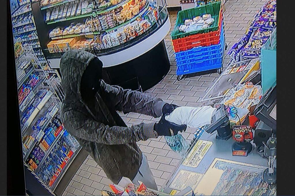 A screen grab from security footage showing the armed man police say robbed a Sebastopol convenience store on Monday, Jan. 15, 2018. (COURTESY OF SEBASTOPOL POLICE DEPARTMENT)