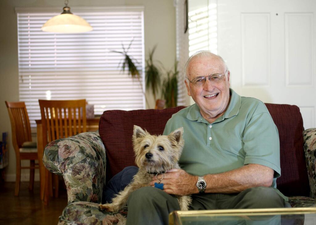 Hank Mattimore with his dog, Sammy, is a village grandparent at the Children's Village of Sonoma County. (BETH SCHLANKER / The Press Democrat)