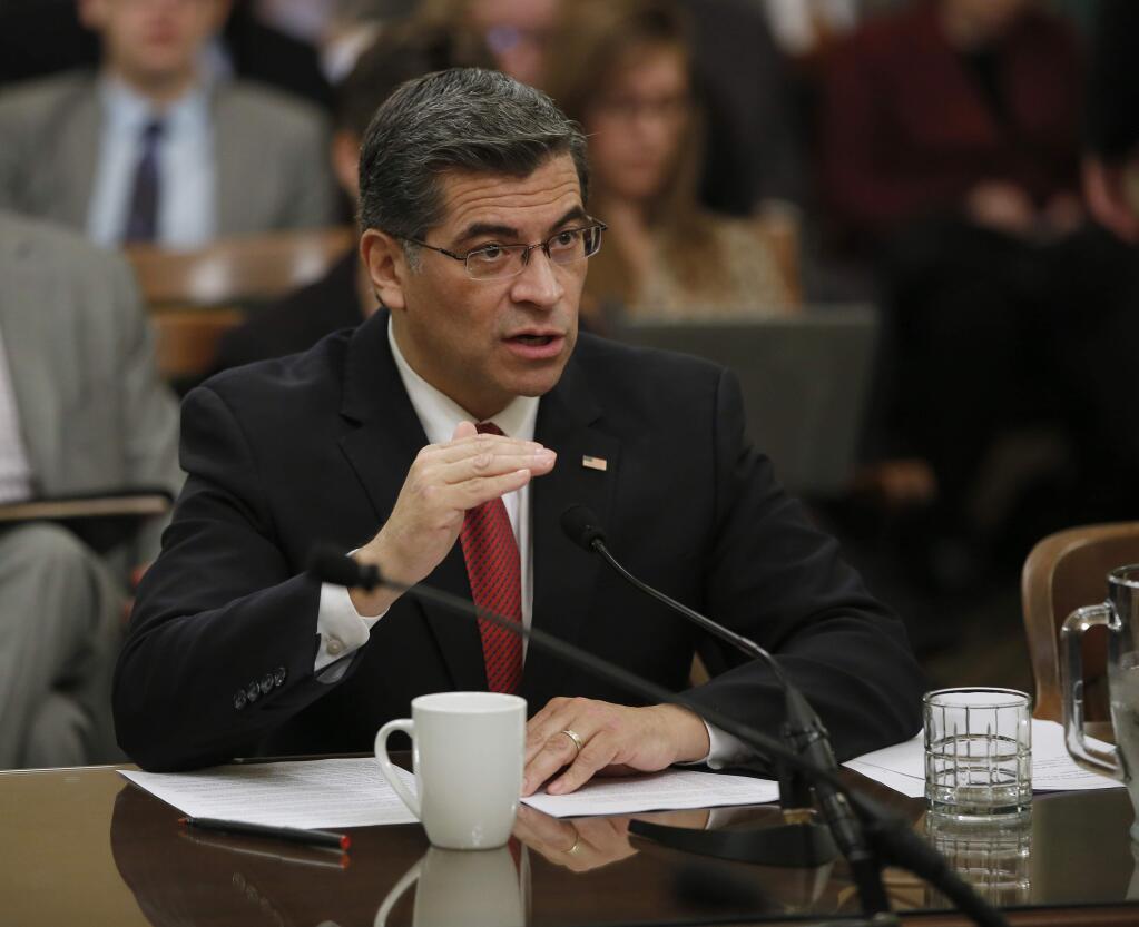 FILE- In this Jan. 10, 2017, file photo, Rep. Xavier Becerra, D-Calif., responds to a lawmakers question during during his confirmation hearing before the Assembly Special Committee on the Office of the Attorney General in Sacramento, Calif. (AP Photo/Rich Pedroncelli, File)