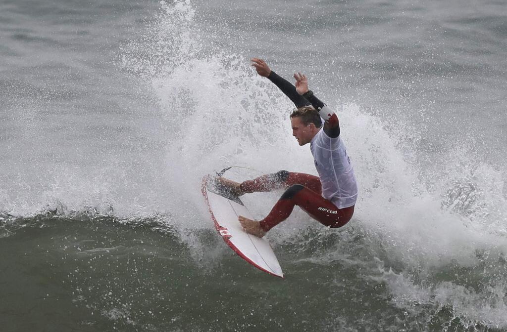 Canada's Cody Young competes in the men's open surfing main round 1, during the Pan American Games on Punta Rocas beach in Lima Peru, Monday, July 29, 2019. (AP Photo/Silvia Izquierdo)