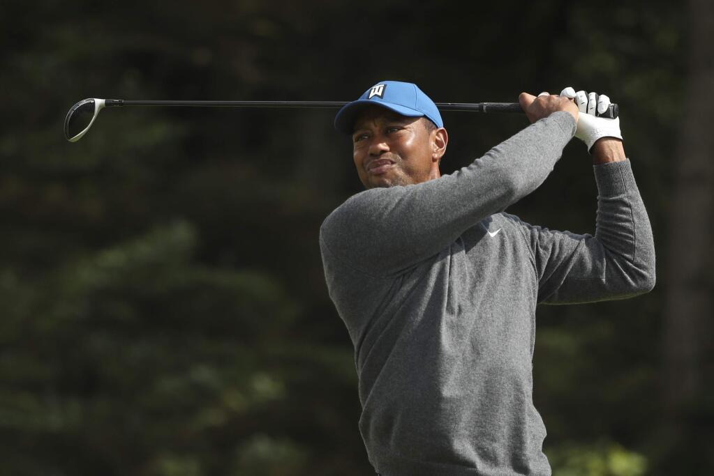 Tiger Woods of the United States plays his tee shot on the 5th hole during the first round of the British Open Golf Championships at Royal Portrush in Northern Ireland, Thursday, July 18, 2019.(AP Photo/Jon Super)