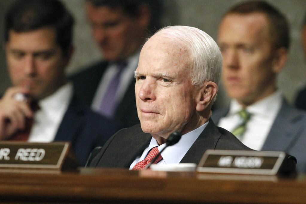 FILE - In this July 11, 2017 file photo, Senate Armed Services Committee Chairman Sen. John McCain, R-Ariz. listens on Capitol Hill in Washington, during the committee's confirmation hearing for Nay Secretary nominee Richard Spencer. Surgeons in Phoenix said they removed a blood clot from above the left eye of McCain. Mayo Clinic Hospital doctors said Saturday, July 15 that McCain underwent a 'minimally invasive' procedure to remove the nearly 2-inch (5-centimeter) clot, and that the surgery went 'very well.' They said the 80-year-old Republican is resting comfortably at his home in Arizona. Pathology reports are expected in the next several days. (AP Photo/Jacquelyn Martin, File)