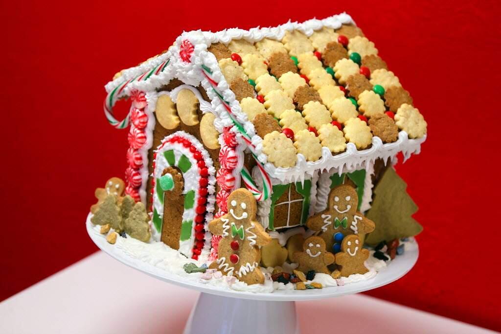A gingerbread house decorated with cookies, candy and gingerbread men. (Christopher Chung/ The Press Democrat)