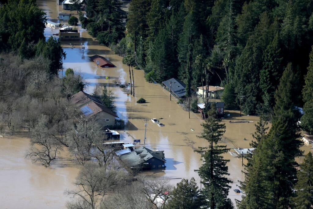 A view of River Road in Guerneville submerged by floodwaters on Feb. 2. (BETH SCHLANKER / The Press Democrat)