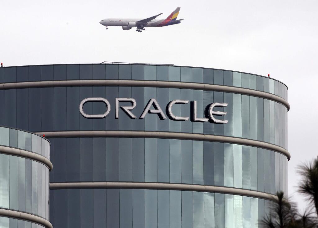 FILE - In this Tuesday, March 20, 2012, file photo, a plane flies over Oracle headquarters in Redwood City, Calif. On Thursday, May 26, 2016, a federal jury sided with Google in a long-running legal battle with tech industry rival Oracle in a complex copyright case that was closely watched in Silicon Valley. Oracle had said Google stole some of its software to create Android, the world's most popular smartphone operating system. Oracle is vowing to appeal. (AP Photo/Paul Sakuma, File)