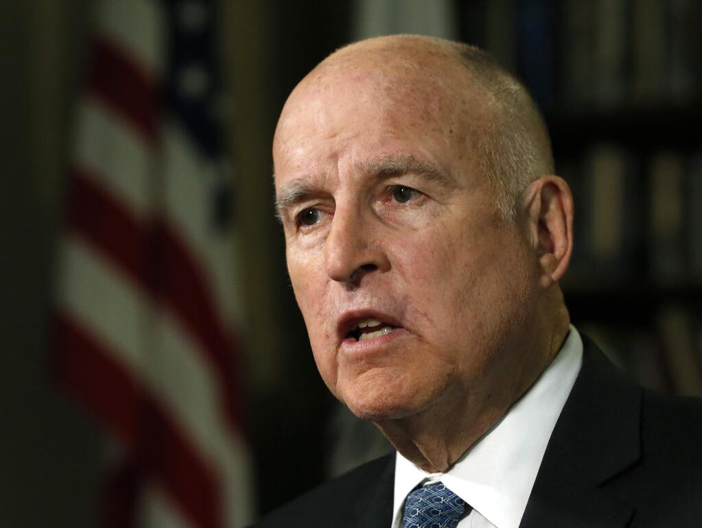 FILE - In this Sept. 10, 2018 file photo, Gov. Jerry Brown speaks during an interview with The Associated Press, in Sacramento, Calif. Brown has been named executive chairman of the Bulletin of the Atomic Scientists, a group that measures manmade threats to human existence. The group manages the Doomsday Clock, a visual representation of how close the Bulletin believes the world is to catastrophe brought on by nuclear weapons, climate change and new technologies. The group announced Thursday, Oct. 25 that the Democratic governor leaving office in January will take over leadership of the Bulletin. (AP Photo/Rich Pedroncelli, File)