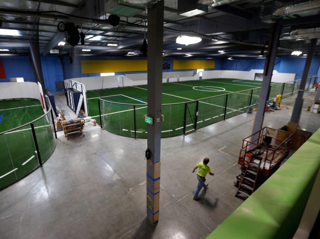 A view of the two Sports City indoor soccer fields under construction, seen from the second floor weight room of Anytime Fitness inside the Epicenter sports complex in Santa Rosa, California on Thursday, September 1, 2016. (Alvin Jornada / The Press Democrat)