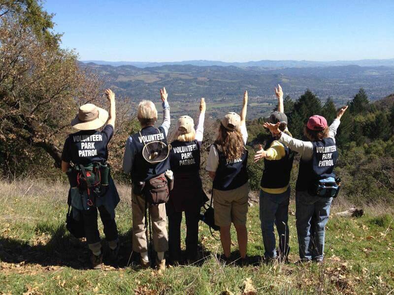 Jack London State Park volunteers salute the view of the Valley from the summit of Sonoma Mountain. (Submitted)