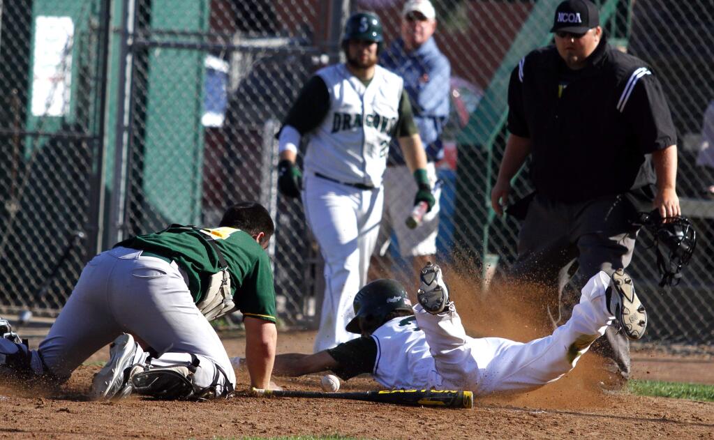 Bill Hoban/Index-TribuneSonoma's Kyle Dunevent (right) manages to score on wild play at home plate during the Dragons' nonleague loss to longtime rival Casa Grande Wednesday afternoon at Arnold Field.