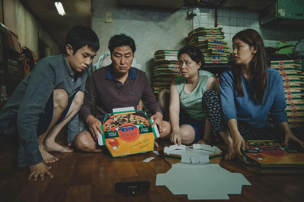 Woo-sik Choi, from left, Kang-ho Song, Hye-jin Jang and So-dam Park in a scene from 'Parasite,' an acclaimed black comedy by Bong Joon Ho about a poor but street-wise family that meets a wealthy family and, through their children, install themselves as tutor and art therapist to the rich family, creating a symbiotic relationship between the two groups. (NEON)
