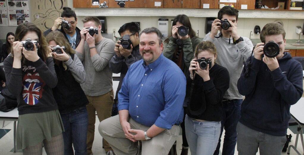 Teacher Andy Mitchell surrounded by his students in the SVHS photography classroom. (Bill Hoban/Index-Tribune)