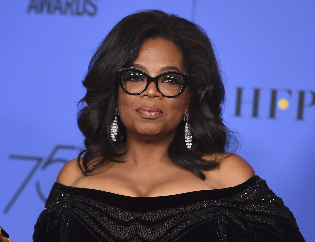 FILE - In this Jan. 7, 2018 file photo, Oprah Winfrey poses in the press room with the Cecil B. DeMille Award at the 75th annual Golden Globe Awards in Beverly Hills, Calif. (Photo by Jordan Strauss/Invision/AP, File)