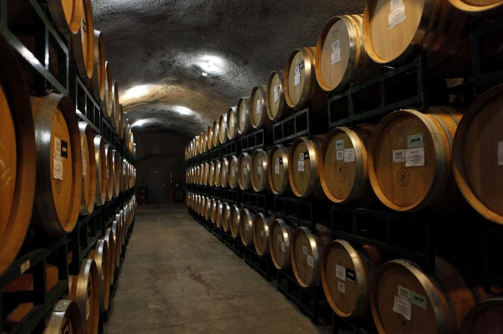 Barrels of wine sit in the cellar at Gloria Ferrer in Sonoma in 2012. (BETH SCHLANKER/ PD FILE)