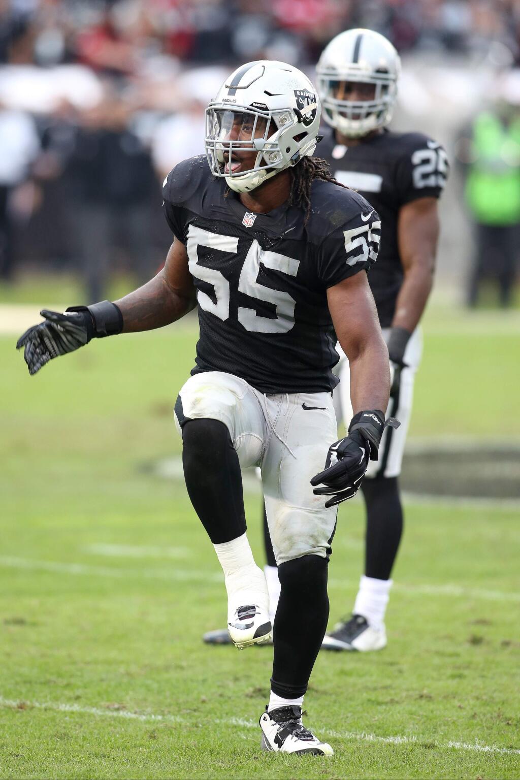Oakland Raiders outside linebacker Sio Moore (55) plays against the San Francisco 49ers during a game at O.com Coliseum in Oakland on Sunday, Dec. 7, 2014. (AP Photo/Michael Zito)