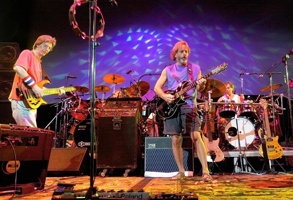 FILE - In this Aug. 3, 2002 file photo, The Grateful Dead, from left, Phil Lesh, Bill Kreutzmann, Bob Weir and Mickey Hart perform during a reunion concert in East Troy, Wis. The group will perform three shows from July 3-5 at Soldier Field in Chicago. (AP Photo/Morry Gash, File)