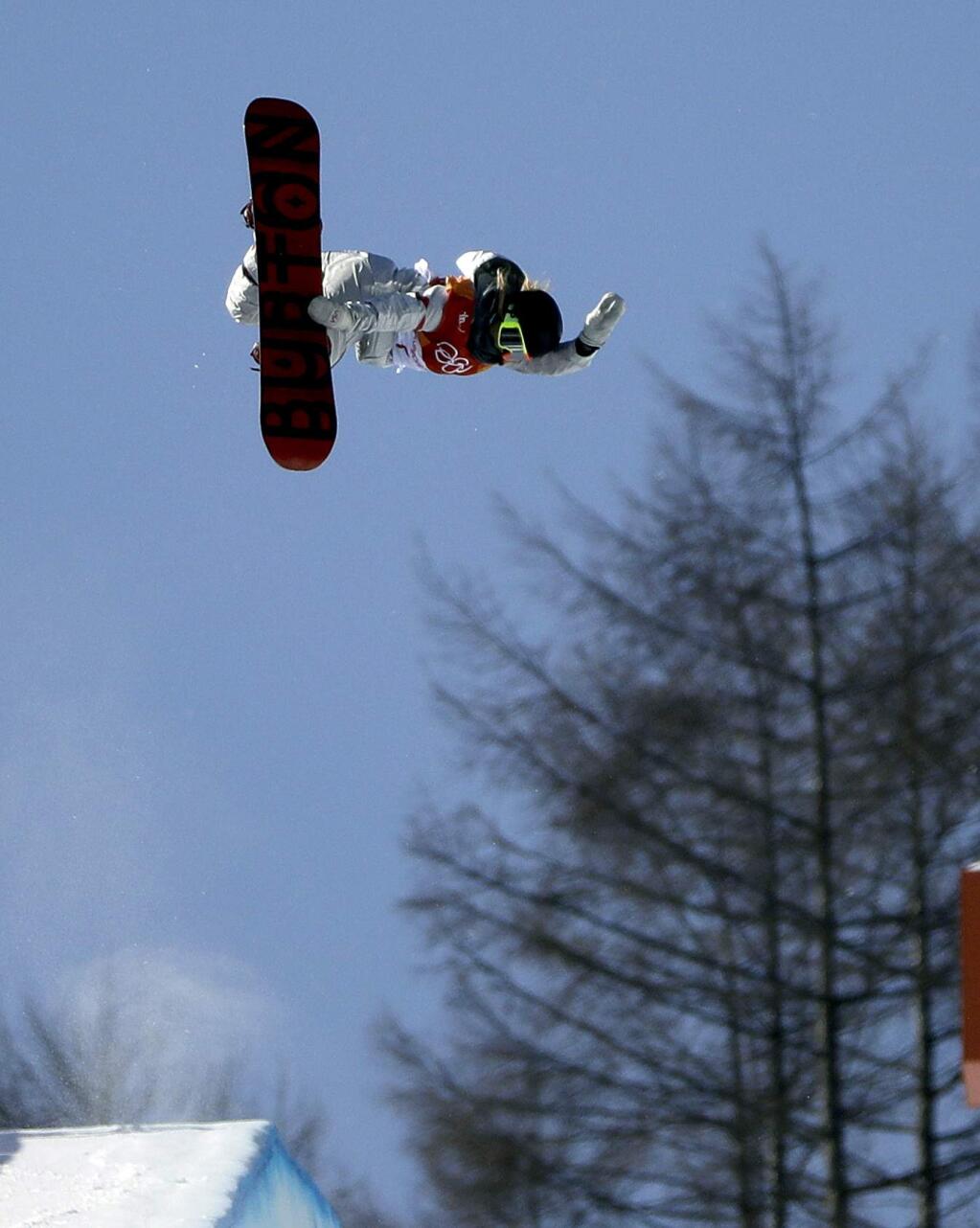 Chloe Kim, of the United States, jumps during the women's halfpipe finals at Phoenix Snow Park at the 2018 Winter Olympics in Pyeongchang, South Korea, Tuesday, Feb. 13, 2018. (AP Photo/Gregory Bull)