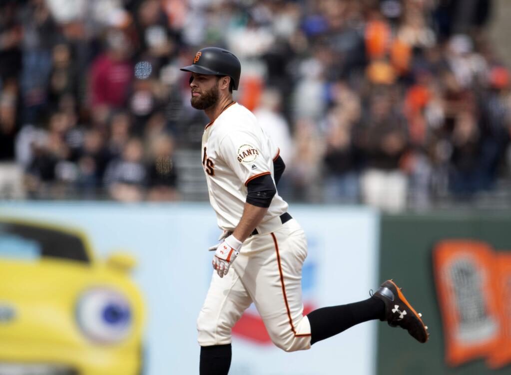 San Francisco Giants' Brandon Belt runs out his three-run home run against the Colorado Rockies during the seventh inning of a baseball game, Sunday, May 20, 2018, in San Francisco. (AP Photo/D. Ross Cameron)
