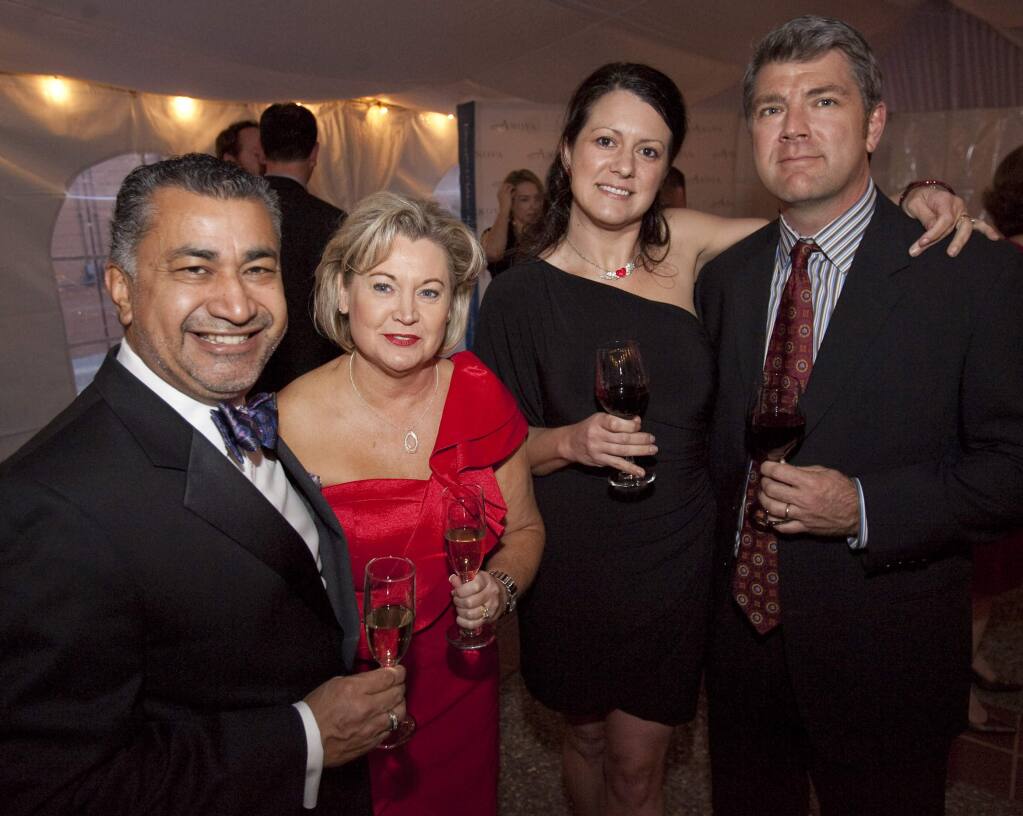 8/9/2012: B1:PC: Left to right, Santa Rosa Mayor Ernesto Olivares with his wife Rita Anova Board of Directors David Mickaelian with his wife Michelle at the Anova Ace of Hearts Red and Pink Ball at the Friedman Event Center in Santa Rosa on Saturday night February 11, 2012. Scott Manchester / For Santa Rosa Magazine