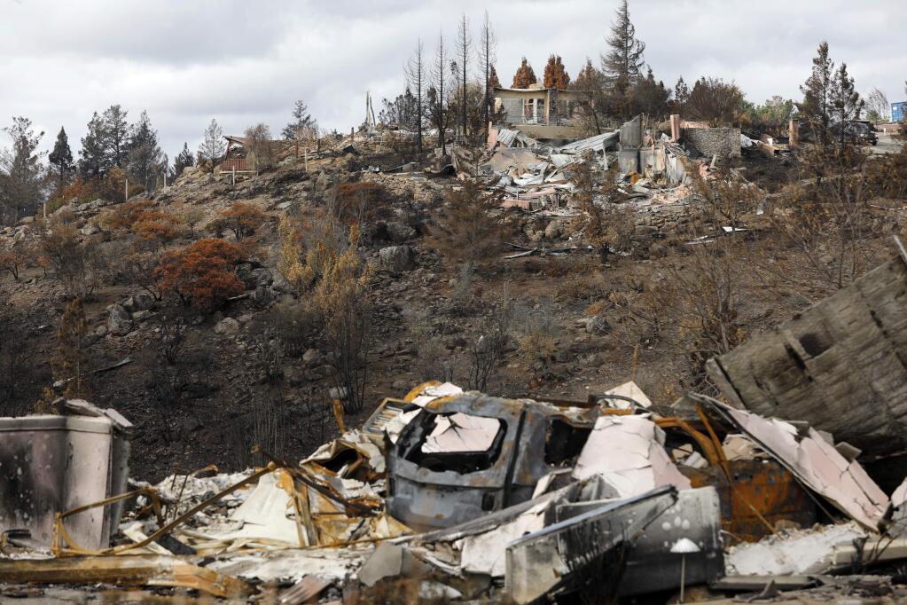 Burned vegetation covers the hillsides around the remnants of homes destroyed in the Tubbs fire in the Fountaingrove area of Santa Rosa. Photo taken on Sunday, November 12, 2017. (BETH SCHLANKER/ The Press Democrat)