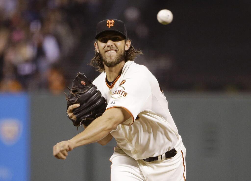San Francisco Giants starting pitcher Madison Bumgarner throws to the San Diego Padres during the fourth inning of a baseball game Monday, May 4, 2015, in San Francisco. (AP Photo/Marcio Jose Sanchez)