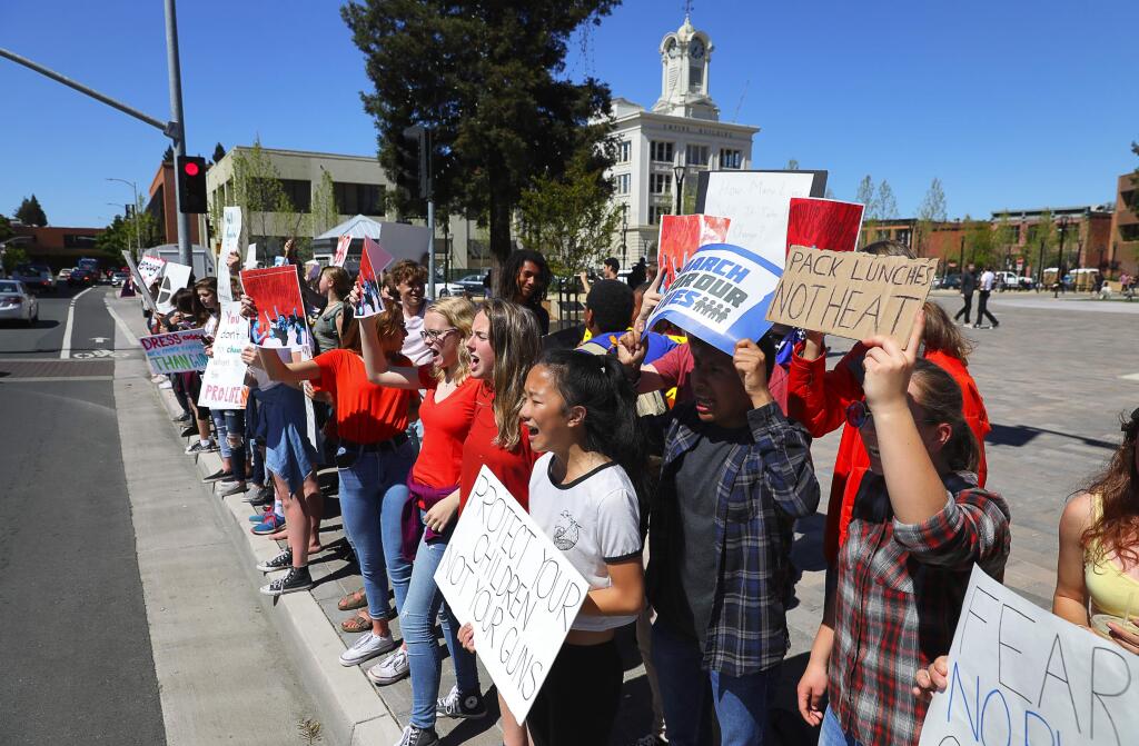 Students gather in Old Courthouse Square to protest against gun violence, in Santa Rosa on Friday, April 20, 2018. (Christopher Chung/ The Press Democrat)