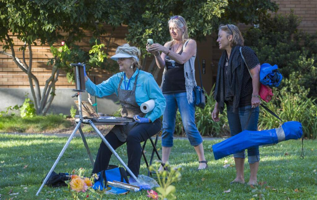 Camille Przewodek attracted some admiring fans during Plein Air's Quickdraw on Sonoma Plaza last Tuesday. (Photo by Robbi Pengelly/Index-Tribune)