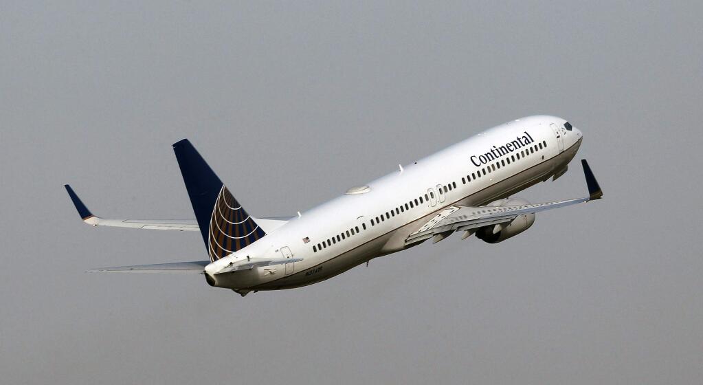 FILE - In this Thursday, Jan. 20, 2011 file photo, A Continental Airlines Boeing 737-NG takes off in Tampa, Fla. (AP Photo/Chris O'Meara, File)