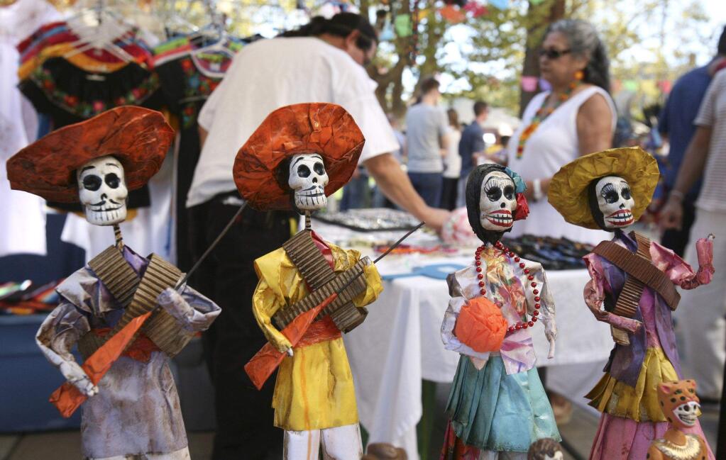 Day of the Dead products for sale at the El Dia de Los Muertos Kickoff Celebration and Health Fair in the plaza of St. Vincent de Paul Catholic Church in Petaluma on Sunday, October 5, 2014.(SCOTT MANCHESTER/ARGUS-COURIER STAFF)