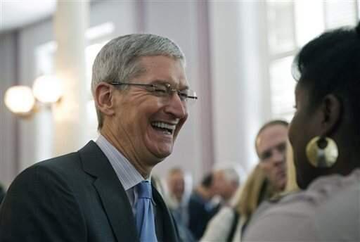 Apple chief executive and Alabama native Tim Cook laughs with a group before an Alabama Academy of Honor ceremony at the state Capitol in this Oct. 27, 2014 file photo taken in Montgomery, Ala. (AP file)