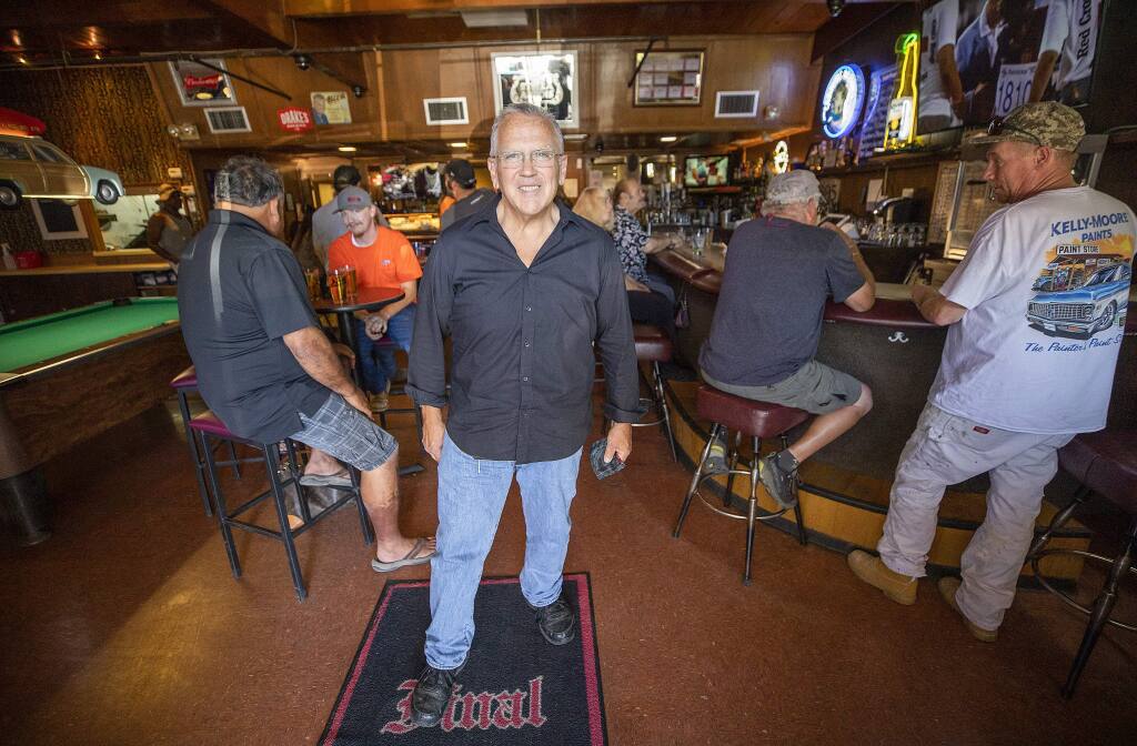 John Timberlake bought the Final Edition Bar & Grill in the Larkfield Shopping Center the year before the Tubbs fire and has since experienced power outages, another wildfire, and now 'the virus apocalypse,” but he struggles on. (photo by John Burgess/The Press Democrat).