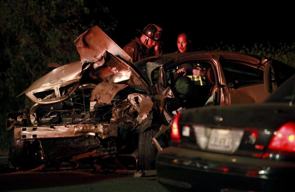 Emergency crews respond to the June 7 crash on Lakeville Highway that killed Betty Osotonu. (BETH SCHLANKER/ PD FILE)