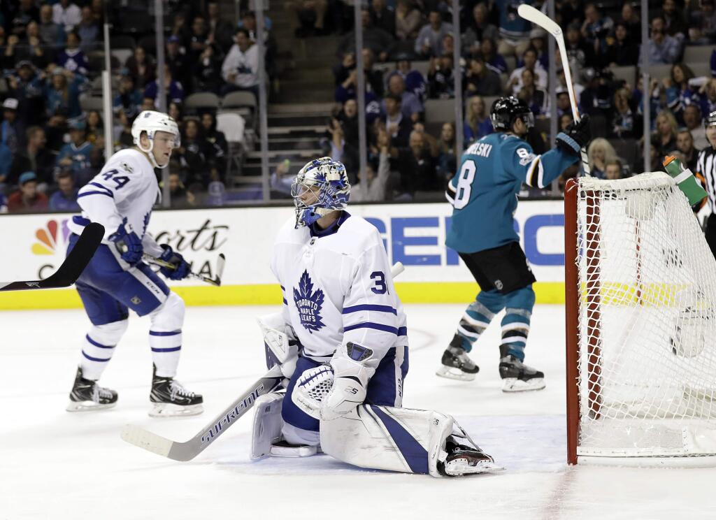 Toronto Maple Leafs goalie Frederik Andersen, center, is beaten for a goal by the San Jose Sharks' Joe Pavelski, right, during the second period Monday, Oct. 30, 2017, in San Jose. (AP Photo/Marcio Jose Sanchez)