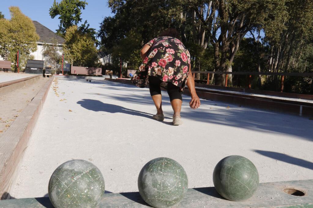 Diane Boggie of 'Team 3' bowls toward the jack or 'pallino' in a practice game for this weekend's Bocce Sonoma Tournament, to be held at Depot Park. (Christian Kallen/Index-Tribune)