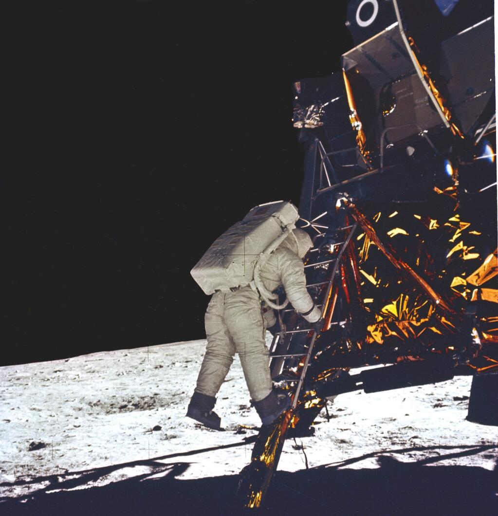 Neil Armstrong desends the Lunar Module to take his first step on the surface of the moon. (NASA)