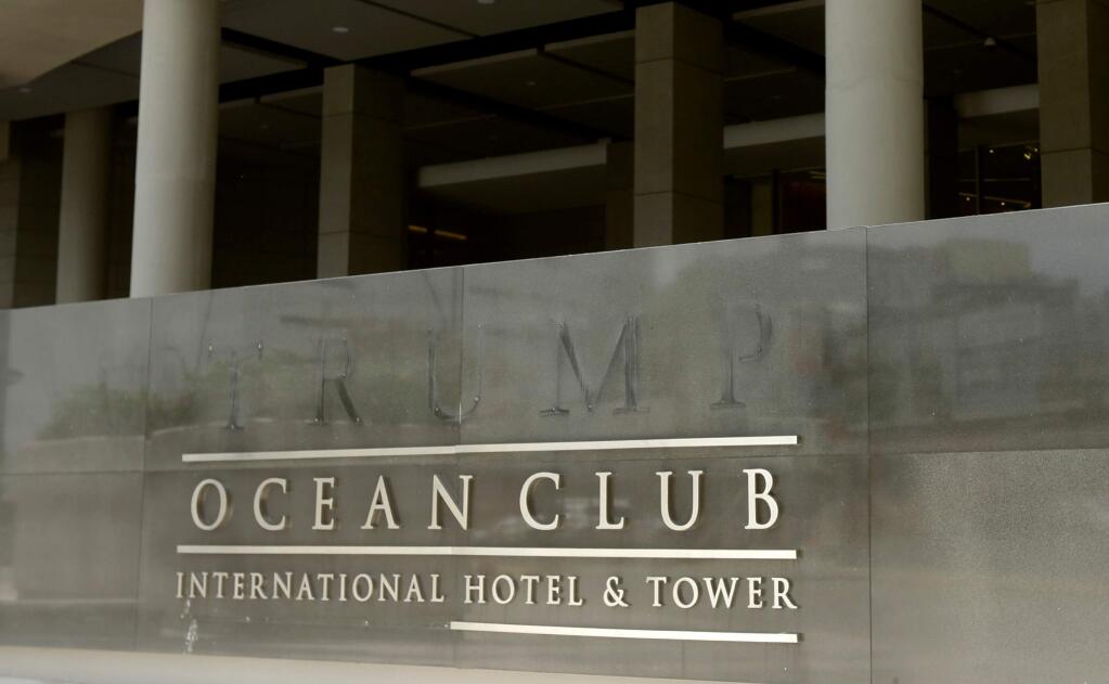 The marking of letters that formerly spelled T-R-U-M-P are part of the marquee outside the former Trump Ocean Club International Hotel and Tower in Panama City, Monday, April 9, 2018. Lawyers representing U.S. President Donald Trump's family hotel business appealed to Panama's president for help through a March 22, 2018 letter, days before an emergency arbitrator declined to reinstate the Trump management team to the luxury waterfront hotel. (AP Photo/Arnulfo Franco)