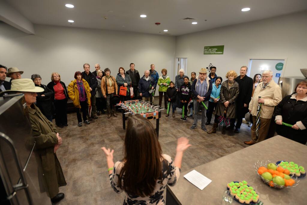 Dorothy Iriks, SAY program manager, addressing guests on a tour in the kitchen of the long-term housing unit during the SAY Dream Center Grand Opening held Saturday afternoon. March 12, 2016. (Photo: Erik Castro/for The Press Democrat)