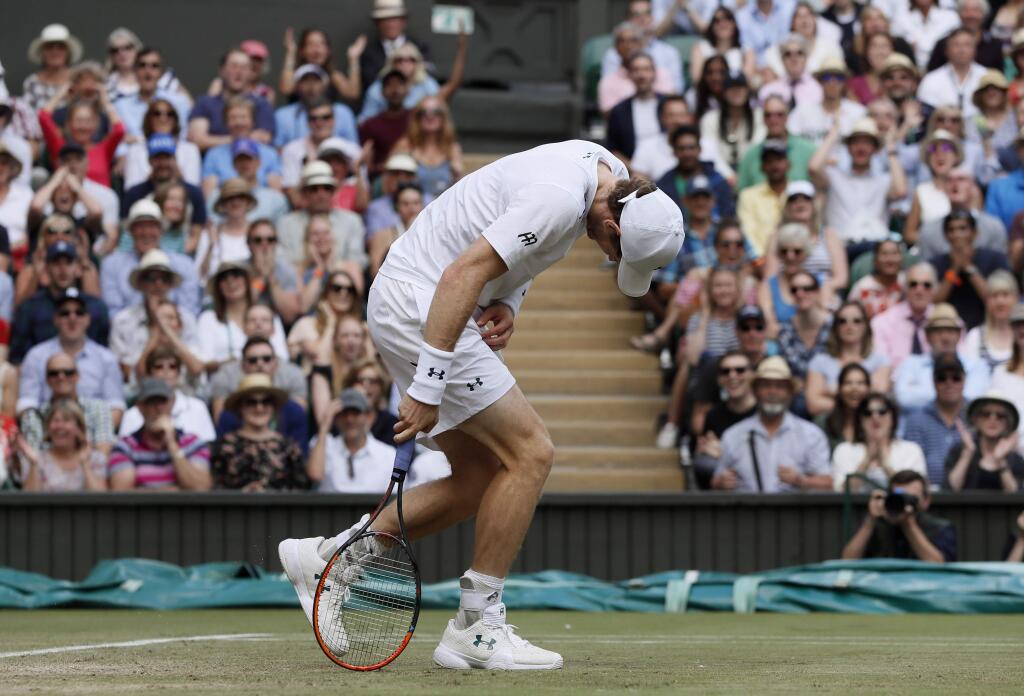 Britain's Andy Murray reacts as he loses a point to Sam Querrey of the United States during their Men's Singles Quarterfinal Match on day nine at the Wimbledon Tennis Championships in London Wednesday, July 12, 2017. (AP Photo/Kirsty Wigglesworth)