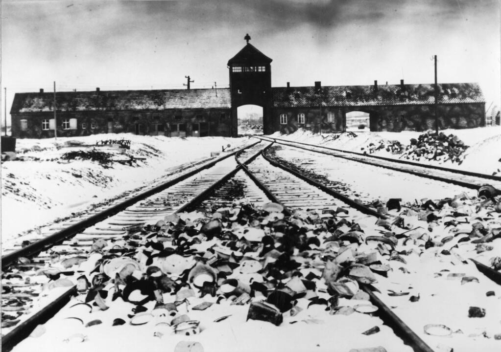 Entry to the concentration camp Auschwitz-Birkenau, Poland, with snow covered railtracks leading to the camp in February/March 1945. The Auschwitz-Birkenau camp was the largest camp where people were terminated during the fascist regime rule of dictator Adolf Hitler over Germany during WWII. (AP Photo/Stanislaw Mucha)
