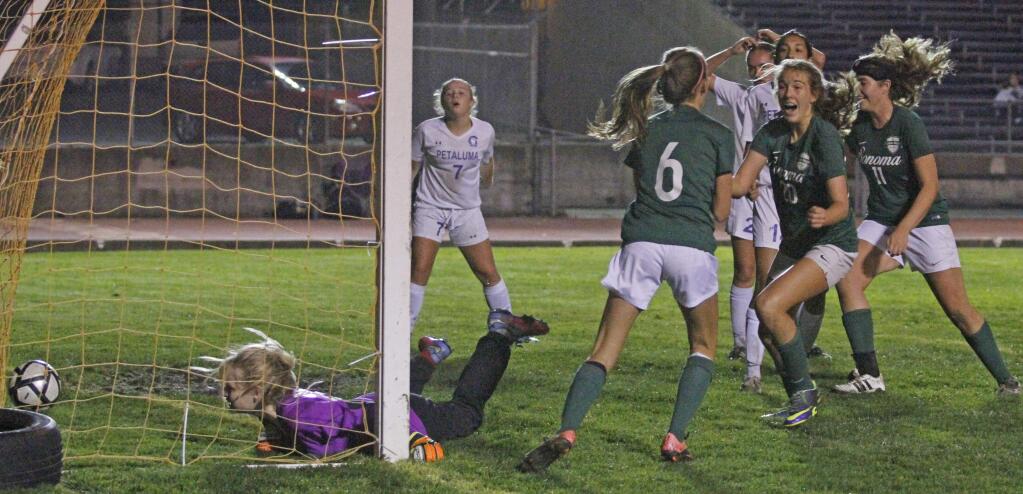 Bill Hoban/Index-TribuneSonoma's Ella Sutter (#6), Shauna Johnston (#20) and Alanna Johnston (11) celebrate Sutter's tying goal in a November playoff against Petaluma that sent the match to a shoot out. The photo, 'Lady Dragons Lose Soccer Shoot Out,' earned second place in this year's CNPA contest.