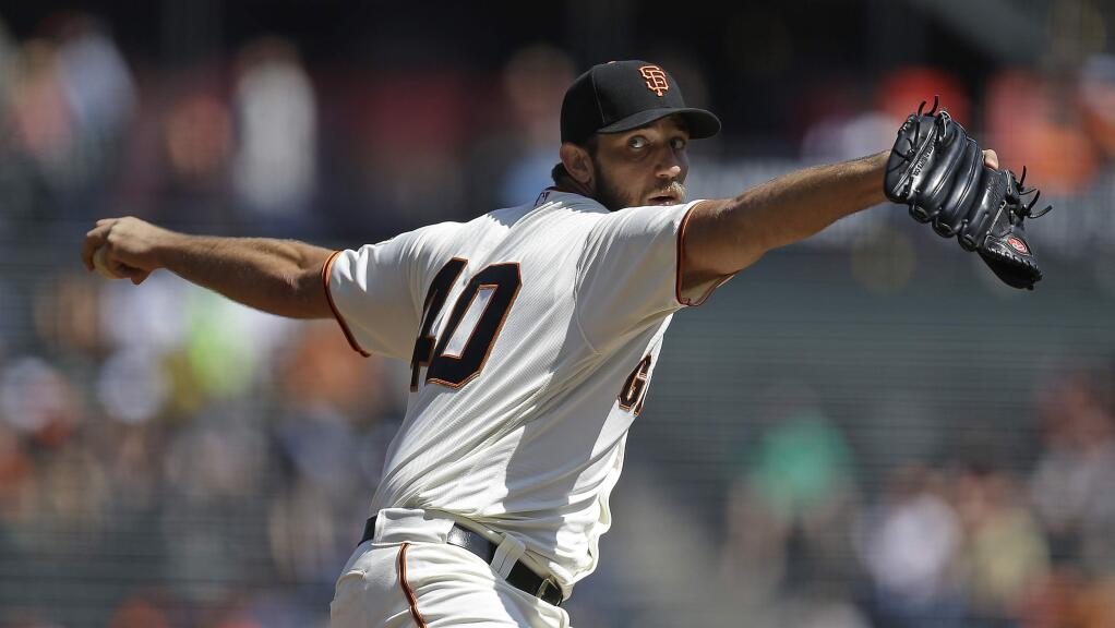 San Francisco Giants pitcher Madison Bumgarner works against the San Diego Padres in the first inning of a baseball game Wednesday, Sept. 14, 2016, in San Francisco. (AP Photo/Ben Margot)