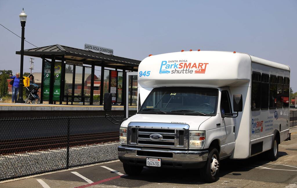 The Santa Rosa ParkSMART shuttle waits for passengers at the downtown Santa Rosa SMART station, on Tuesday, August 14, 2018. (Christopher Chung/ The Press Democrat)