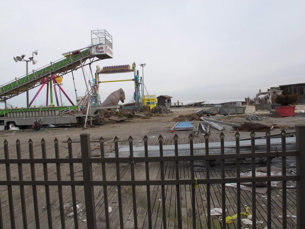 This Jan. 25, 2013 photo shows the former Funtown Pier in Seaside Park, N.J., three months after it was heavily damaged by Superstorm Sandy, and eight months before it was destroyed by a fire. Seaside Park officials this week imposed height restrictions for rides on a rebuilt pier that prompted its owner to scrap plans for rebuilding the historic pier, saying it would not be financially viable without thrill rides of as tall as 300 feet, Thursday, July 28, 2016. (AP Photo/Wayne Parry)