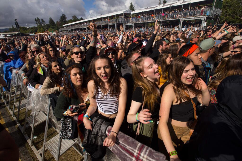 Concertgoers at the 2019 BottleRock dance as they watch Michael Franti of Michael Franti & Spearhead perform during the third day of the music festival in Napa. The 2020 festival, initially pushed to October because of the coronavirus, has been rescheduled for 2021. (Photo by Darryl Bush / For The Press Democrat)