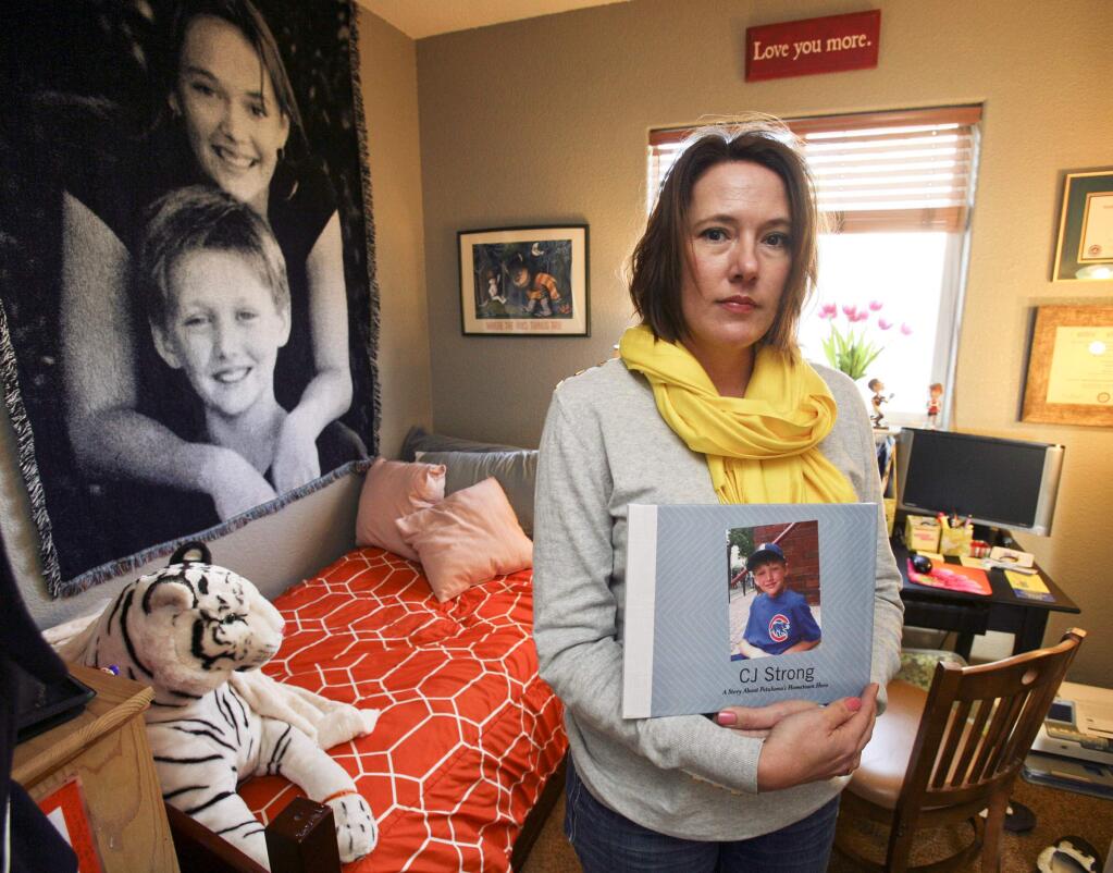 Heather Banaszerk, mother of CJ Banaszerk who passed away after a battle with chronic myeloid leukemia in his bedroom that she has made into her office to promote Alex's Lemonade Stand Foundation's (ALSF's) fundraising to raise funds for childhood cancer research on Monday Janauary 26, 2015. (SCOTT MANCHESTER/ARGUS-COURIER STAFF)