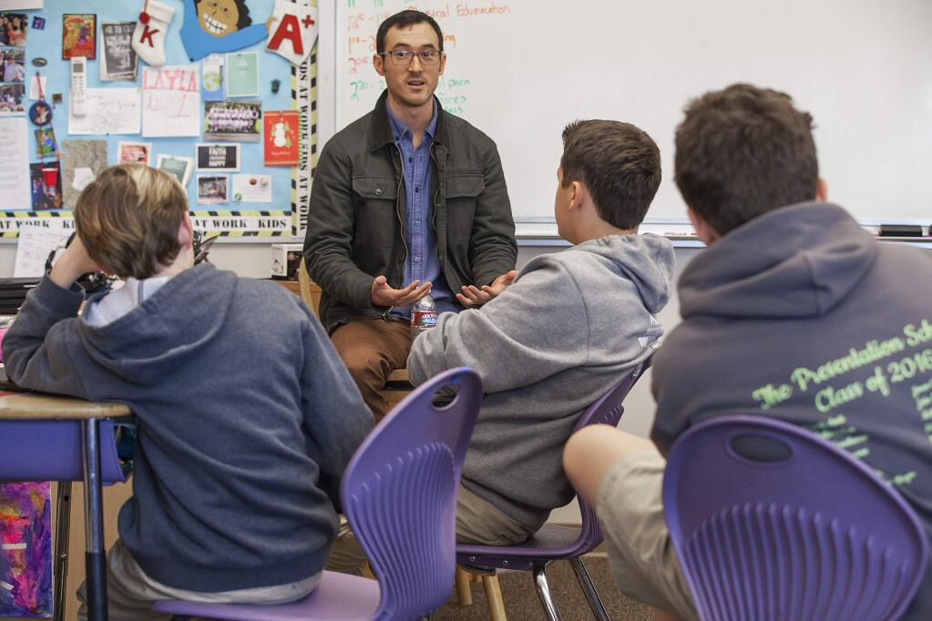 KQED presenter Devin Katayama recently visited a sixth-grade, reading-aloud lab class at Presentation School. He spoke with the students about the nature of public radio, his job with them and the skills required for being an effective newsreader and presenter. (Photos by Robbi Pengelly/Index-Tribune)