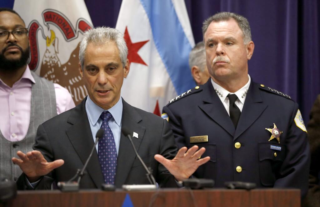 Chicago Mayor Rahm Emanuel, left, and Police Superintendent Garry McCarthy appear at a news conference, Tuesday, Nov. 24, 2015, in Chicago, announcing first-degree murder charges against police officer Jason Van Dyke in the Oct. 20, 2014, death of 17-year-old Laquan McDonald. The city then released the dash-cam video of the shooting to media outlets after the news conference. (AP Photo/Charles Rex Arbogast)