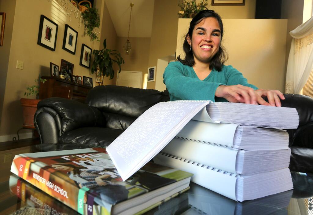 Students at Windsor High School surprised blind student Maycie Vorreiter with at four-volume edition of her senior yearbook in braille. (John Burgess/The Press Democrat)