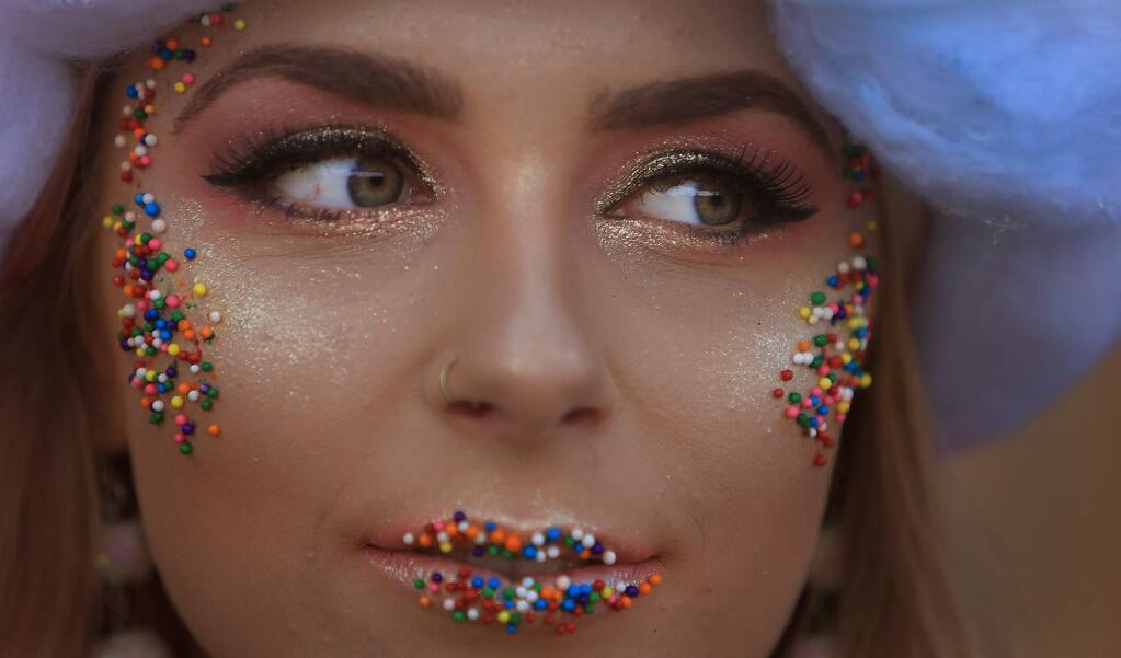 Jenny Kuykendall, 21, a model with Julie Nation, prepares to go onstage during Catwalk for a Cure, Friday, Oct. 5, 2018 at the Luther Burbank Center for the Arts in Santa Rosa. (Kent Porter / The Press Democrat) 2018