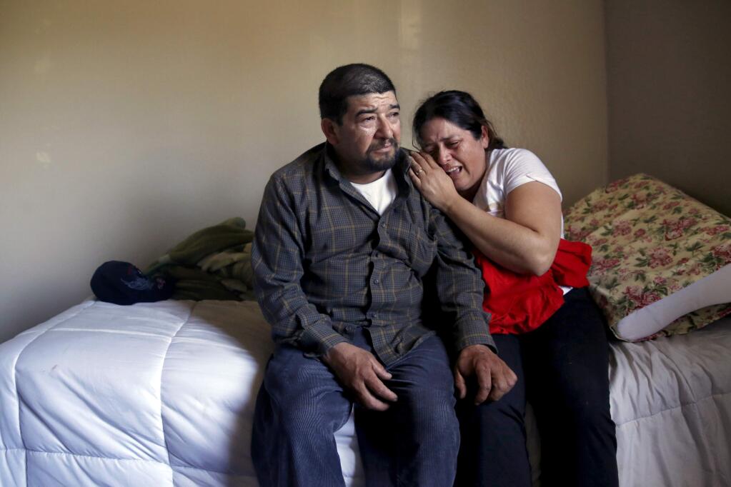 Federico and Silvia Contreras mourn the loss of their 16-year-old daughter Angelica at their home in Cloverdale, on Sunday, June 7, 2015. (BETH SCHLANKER/ The Press Democrat)